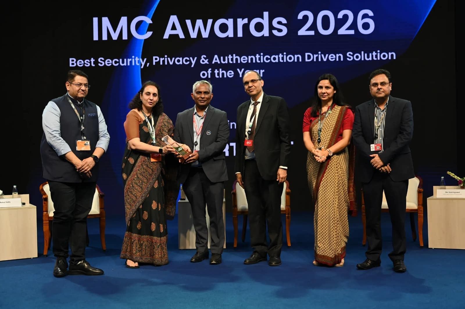 Group accepting security privacy and authentication award at IMC 2026
